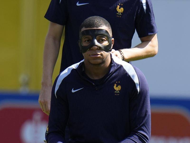 Kylian Mbappe wore a mask during France's final training session ahead of their clash with Poland (AP PHOTO)