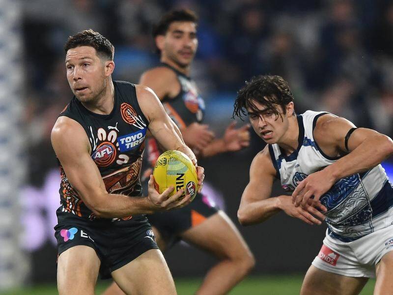 Toby Greene (left) kicked the decisive goal as the Giants held on to beat Geelong by four points. (Julian Smith/AAP PHOTOS)