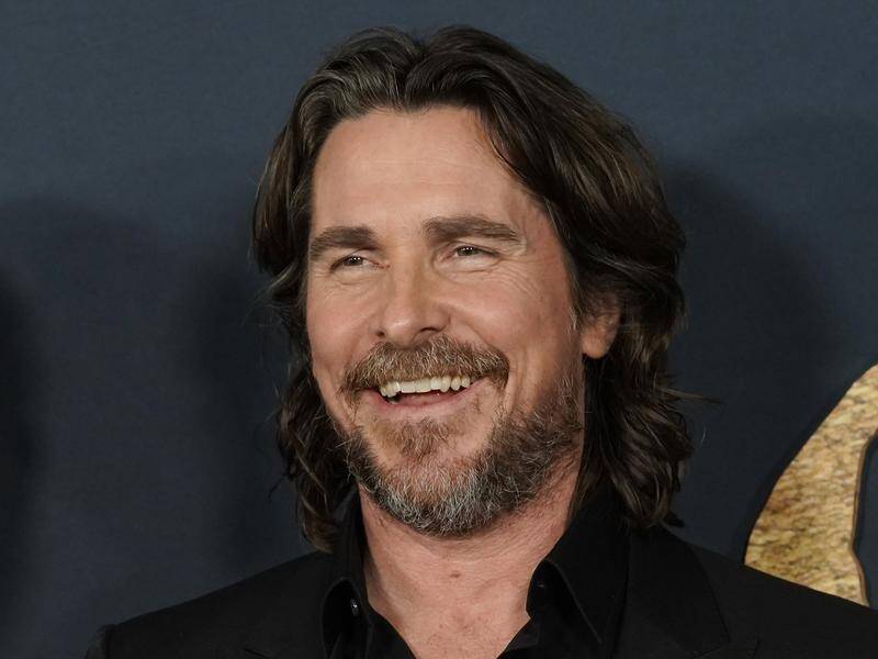 Christian Bale has launched the building of a dozen homes to keep siblings in foster care together. (AP PHOTO)