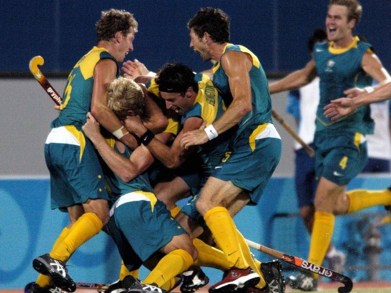 Australia's men's hockey team won Olympic gold thanks to a goal from Jamie Dwyer (second left). (Dean Lewins/AAP PHOTOS)