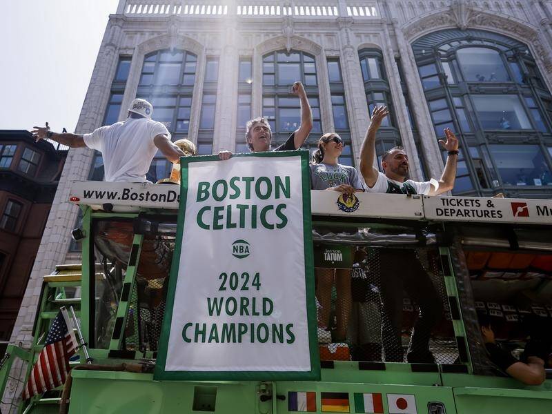 Boston Celtics players soak up the applause during the team's NBA Championship parade last month. (EPA PHOTO)