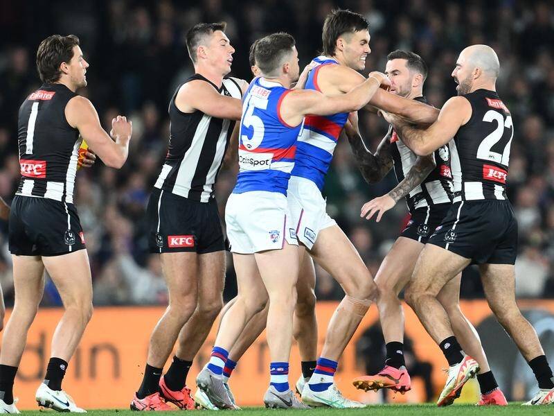 Collingwood players were not impressed with Western Bulldogs big man Sam Darcy (centre) on Friday. (Joel Carrett/AAP PHOTOS)