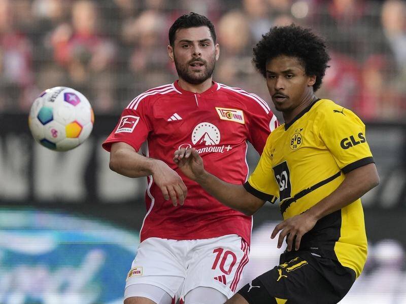 Karim Adeyemi (right) scored his first goal of the season to help Dortmund win 2-0 at Union Berlin. (AP PHOTO)