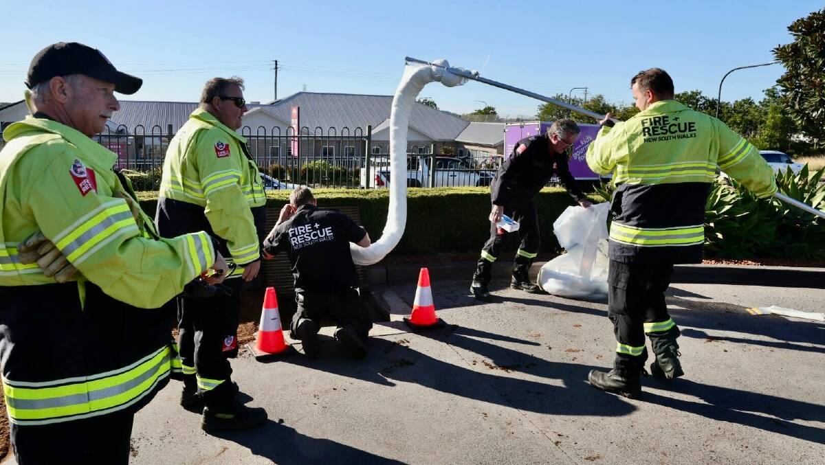 Firefighters at the scene of a fuel spill at Hungry Jacks in Haywards Bay on Friday, June 28, 2024. Pictures by Sylvia Liber 
