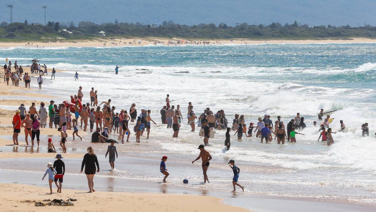 North Wollongong Beach was very busy at midday on Sunday, October 1 due to scorching temperatures. Picture by Wesley Lonergan