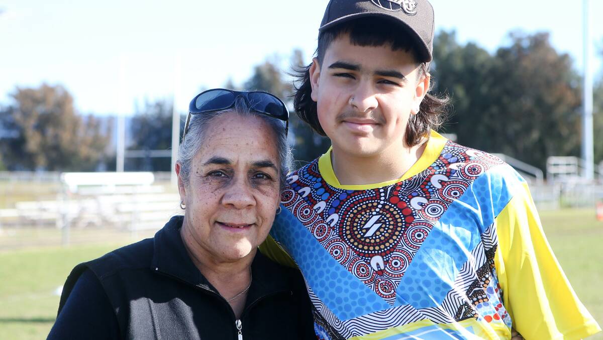 Illawarra police and members of the community, including school students, took part in the inaugural Gunji Origin Oz-Tag Reconciliation Cup in September 2022. Aunty Lindy is pictured with Harper Gee. Picture by Sylvia Liber