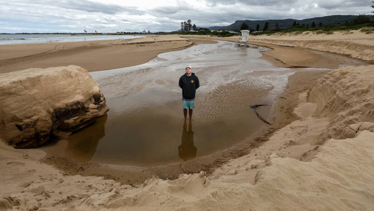 Bulli surf club president Jamie Caldwell standing in a heavily eroded area of Bulli Beach following wild weather on November 4-5. Picture by Adam McLean