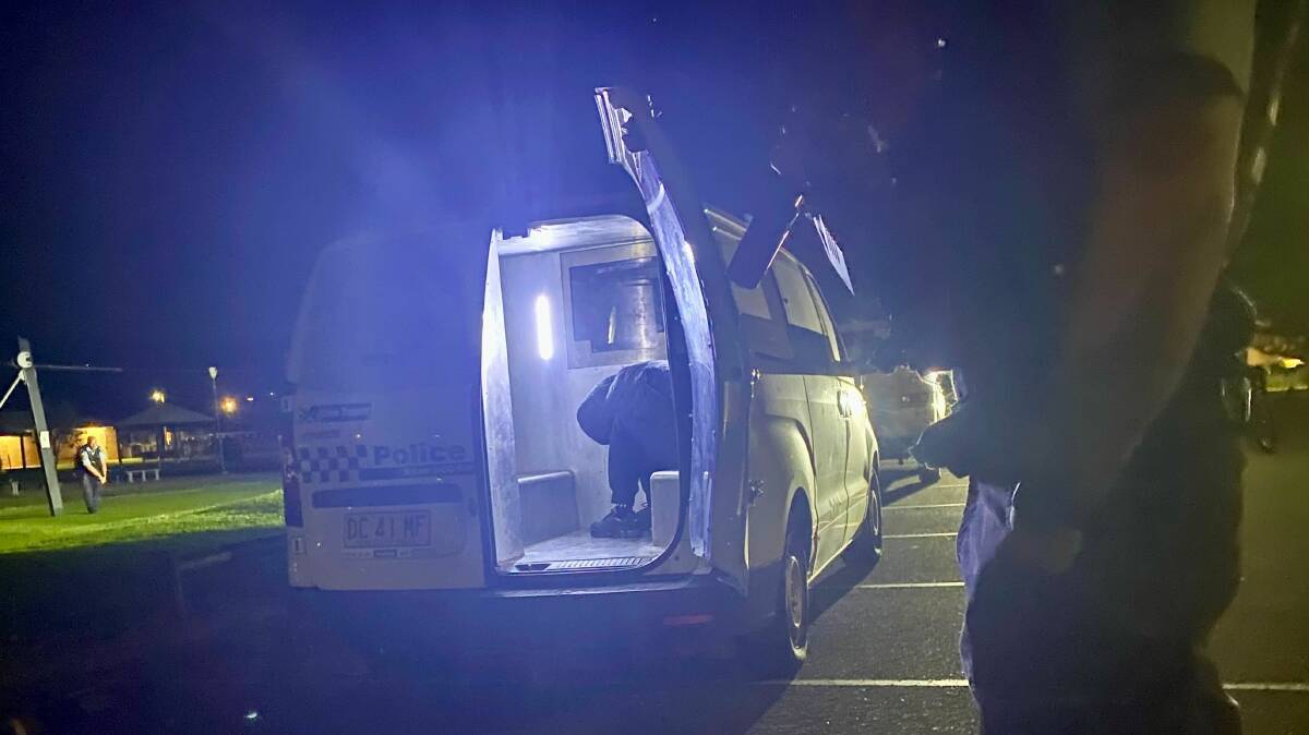 A person in the back of a police vehicle at Woonona on Wednesday, September 6. Picture by Angela Thompson