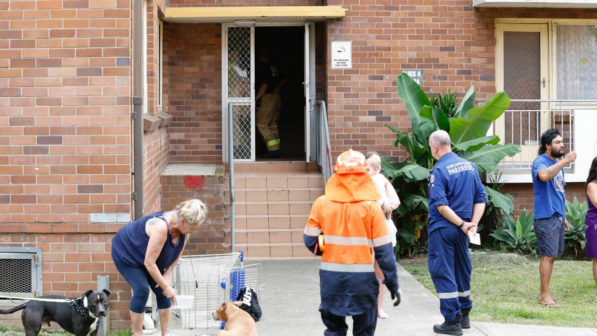 Emergency services at the scene of a fire in a unit block on Todd Street at Warrawong on Friday, February 23, 2024. Pictures by Anna Warr