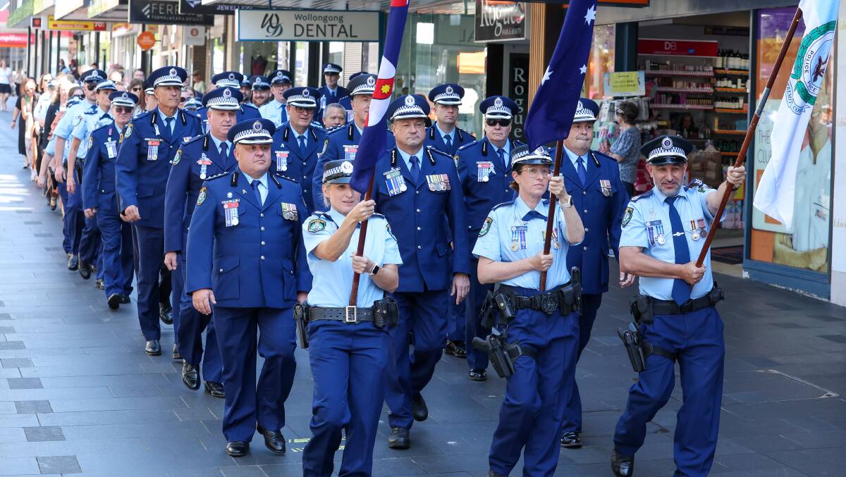 The NSW Police force march along Crown Street to Wesley Uniting Church on Friday, September 29, 2023. Picture by Adam McLean