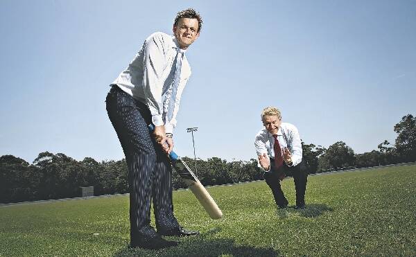 Adam Gilchrist checks out the surface at University Oval with University of Wollongong Vice-Chancellor Gerard Sutton. Picture: KEN ROBERTSON