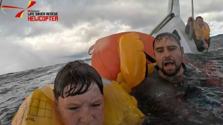 (from left) Logan Banek, James Connelly and Stuart Perry were rescued after their shark fishing boat sunk of Coalcliff on Saturday, April 27, 2024. Picture by Westpac Rescue Helicopter
