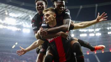 Josip Stanisic (C) scored a late equaliser for Leverkusen as they reached the Europa League final. (EPA PHOTO)